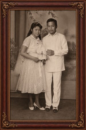Kung Fu Hand Painting - Beautifully restored vintage studio portrait captures a poised couple in elegant formal attire, preserved with warm sepia tones and refined detail. A rich rosewood frame with gold inlay and ornate corners adds heirloom charm, creating a timeless keepsake ready to display, celebrate family history, and treasure for generations to come.