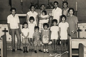 Kung Fu Hand Painting - A beautifully restored vintage family portrait captures generations gathered in a warm church setting, rich with history, dignity, and quiet emotion. Enhanced detail reveals expressive faces, timeless clothing, altar candles, wooden pews, and treasured heritage, creating a meaningful keepsake that celebrates family, memory, and enduring love.